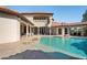 Backyard with a pool and sundeck, spiral staircase to an upper balcony, and a covered lounge at 11158 Warm Wind Way, Weeki Wachee, FL 34613