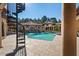 Resort-style pool features rock waterfall feature, fountains, covered lounge areas and spiral staircase at 11158 Warm Wind Way, Weeki Wachee, FL 34613
