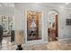 Elegant wine cellar showcase with decorative shelving, and arched detailing, with ornate decor at 11158 Warm Wind Way, Weeki Wachee, FL 34613