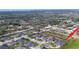 A panoramic aerial view shows the location of the house relative to the community and surrounding landscape at 2385 Arboretum Dr, Palm Harbor, FL 34683