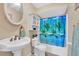 A bathroom with a shower/tub combo and updated vanity at 2709 57Th S St, Gulfport, FL 33707