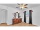 A bedroom featuring a dresser, a ceiling fan, and closet space at 2709 57Th S St, Gulfport, FL 33707