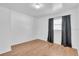 An empty bedroom with hardwood floors and a window at 2709 57Th S St, Gulfport, FL 33707