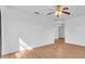 Bright living room with wood floors, white walls, and a ceiling fan at 2709 57Th S St, Gulfport, FL 33707