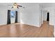 Bright living room featuring wood floors, a ceiling fan, and a large window for ample light at 2709 57Th S St, Gulfport, FL 33707