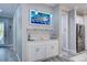 Wet bar situated between the living area and kitchen, decorated with coastal-themed decor at 817 Wilkie St, Dunedin, FL 34698