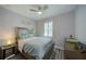 Charming bedroom featuring stylish decor, a ceiling fan, and a comfortable bed at 817 Wilkie St, Dunedin, FL 34698