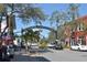 Street view of downtown Dunedin with shops, restaurants, and the 