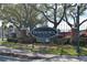 Welcome to Downtown Dunedin sign with brick pillars, manicured landscaping, and decorative lighting at 817 Wilkie St, Dunedin, FL 34698