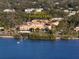 Aerial view of the historic Fenway Hotel near the water, with a waterfront view in Dunedin at 817 Wilkie St, Dunedin, FL 34698