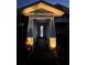 Charming front entrance with decorative glass door, detailed trim, and inviting outdoor lighting at 817 Wilkie St, Dunedin, FL 34698