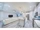 Open floorplan showcasing the kitchen island, living room, and modern entertainment center at 817 Wilkie St, Dunedin, FL 34698