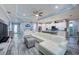 Spacious living area seamlessly connects to a modern kitchen, creating an inviting and open atmosphere at 817 Wilkie St, Dunedin, FL 34698