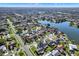 Scenic aerial view of a residential neighborhood with lush greenery and a tranquil lake at 912 Lochmont Dr, Brandon, FL 33511