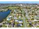 Aerial view showcasing a residential neighborhood with a pond and a mix of single-Gathering homes at 912 Lochmont Dr, Brandon, FL 33511