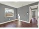 Bedroom featuring gray walls, white trim, and a window, providing a simple and inviting space at 912 Lochmont Dr, Brandon, FL 33511