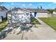 Charming single-story home featuring a well-manicured lawn and an attached one car garage at 912 Lochmont Dr, Brandon, FL 33511