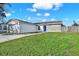 Attractive one-story home with a well-maintained lawn, fenced in yard, and brick accents at 912 Lochmont Dr, Brandon, FL 33511