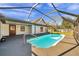 Private screened-in pool with railing, perfect for relaxation and outdoor enjoyment at 1016 Mandalay Dr, Brandon, FL 33511