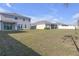 Vast backyard showcasing the property's large lawn, providing ample space for recreation and enjoyment at 10944 Delta Huff Ct, San Antonio, FL 33576