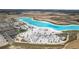 Overhead view showcasing a community's recreational lagoon and beach, equipped with beach chairs and playgrounds at 10944 Delta Huff Ct, San Antonio, FL 33576