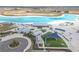 Aerial view of community lagoon, showcasing the recreation area, beach, and swimming area at 10944 Delta Huff Ct, San Antonio, FL 33576