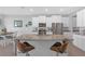 Spacious kitchen island with seating, granite countertops, and stainless steel appliances at 10944 Delta Huff Ct, San Antonio, FL 33576
