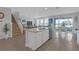 Spacious open kitchen with a large island, stainless steel appliances, and seamless transition to the living area at 10944 Delta Huff Ct, San Antonio, FL 33576