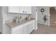 Close-up view of white cabinets and granite countertops in the kitchen at 10944 Delta Huff Ct, San Antonio, FL 33576
