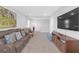 Upstairs living area offering comfortable seating, media center, and bright natural light at 10944 Delta Huff Ct, San Antonio, FL 33576