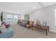 Upstairs living area features comfortable seating, stylish decor, and abundant natural light at 10944 Delta Huff Ct, San Antonio, FL 33576