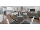 Open-concept living space with kitchen, dining area, and living room at 10944 Delta Huff Ct, San Antonio, FL 33576