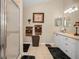 Clean bathroom with a glass-enclosed shower and neutral tile flooring at 11427 Turtle Dove Pl, New Port Richey, FL 34654