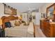 Cozy bedroom with a decorative tapestry and wood furniture at 11427 Turtle Dove Pl, New Port Richey, FL 34654