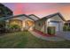 Charming single-Gathering home featuring a manicured lawn and a welcoming front porch at 11427 Turtle Dove Pl, New Port Richey, FL 34654