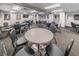 Functional game room with chairs and round tables, perfect for card games or board games at 11427 Turtle Dove Pl, New Port Richey, FL 34654