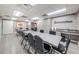 Large game room featuring lots of tables and chairs with a small kitchenette area to enjoy snacks and drinks at 11427 Turtle Dove Pl, New Port Richey, FL 34654