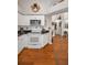 Well-lit kitchen with white appliances and decorative elements at 11427 Turtle Dove Pl, New Port Richey, FL 34654