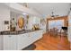 Bright kitchen with white cabinetry and a view into the dining area at 11427 Turtle Dove Pl, New Port Richey, FL 34654