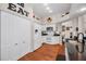 White kitchen featuring modern appliances and an 'EAT' wall decoration at 11427 Turtle Dove Pl, New Port Richey, FL 34654