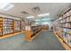 Well-stocked library with a variety of books and comfortable seating for reading at 11427 Turtle Dove Pl, New Port Richey, FL 34654