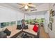 Sunroom/Gameroom features ample seating, lots of windows, and a ceiling fan at 11427 Turtle Dove Pl, New Port Richey, FL 34654