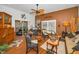 Well-lit living room features unique decor, wood floors, and comfortable seating arrangements at 11427 Turtle Dove Pl, New Port Richey, FL 34654