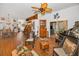 Spacious living room features wood floors, unique decor, and seamless transitions to other living areas at 11427 Turtle Dove Pl, New Port Richey, FL 34654