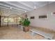 Relaxing lounge with stone benches, plants, and secure gated access with a view to garden at 11427 Turtle Dove Pl, New Port Richey, FL 34654