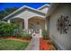 Inviting porch featuring a cozy seating area, perfect for relaxing and enjoying the outdoors at 11427 Turtle Dove Pl, New Port Richey, FL 34654