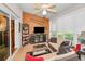 Inviting sunroom with comfortable seating, ceiling fan and natural light, perfect for relaxing and entertaining at 11427 Turtle Dove Pl, New Port Richey, FL 34654