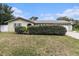 Charming single story home with lovely landscaping provides great curb appeal on a sunny day at 12397 88Th Ave, Seminole, FL 33772