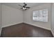 Bedroom with a window letting in natural light and wood-look tile flooring at 1510 James L Redman Pkwy, Plant City, FL 33563