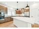 Stylish kitchen with stainless steel appliances, ample storage, and a large island at 28784 Rambutan Dr, Wesley Chapel, FL 33543